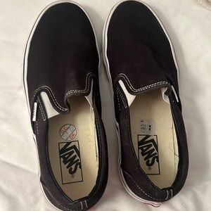 Size 8.5 vans. Black slips on.